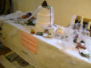 a rat sits on top of the cake